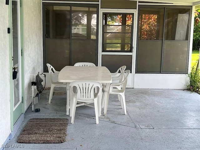 52 Heath Aster Ln, Lehigh Acres, FL 33936 - view of patio / terrace featuring outdoor dining space