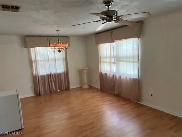52 Heath Aster Ln, Lehigh Acres, FL 33936 - unfurnished room featuring healthy amount of natural light, ceiling fan, and light wood-type flooring