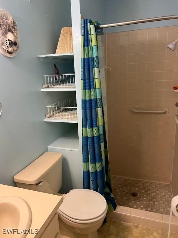 52 Heath Aster Ln, Lehigh Acres, FL 33936 - bathroom with vanity, a shower stall, toilet, and tile patterned flooring