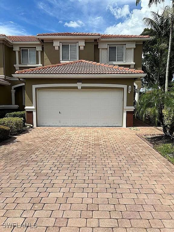 mediterranean / spanish-style home featuring a garage