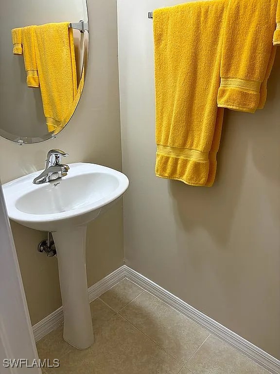 bathroom featuring tile patterned floors and sink