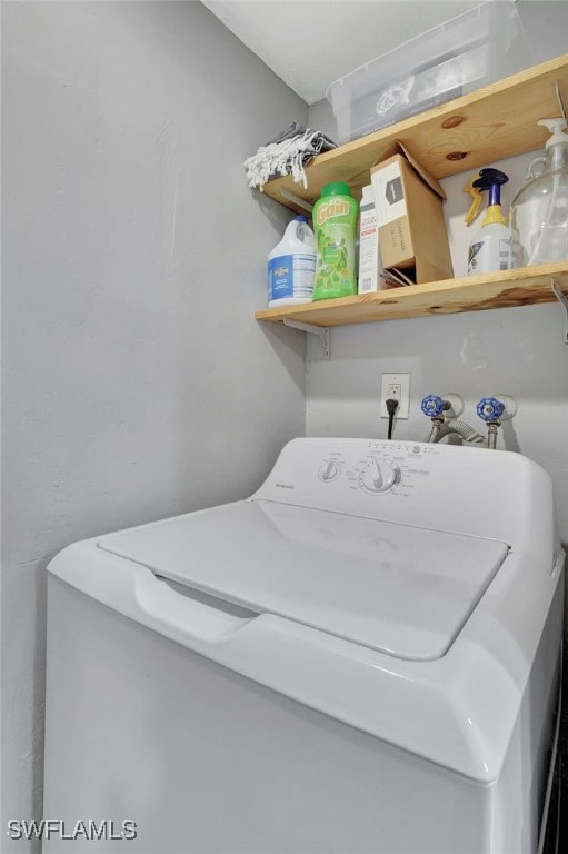 clothes washing area with washer / dryer