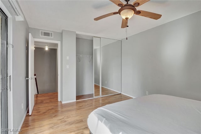 bedroom featuring a closet, ceiling fan, and light hardwood / wood-style floors