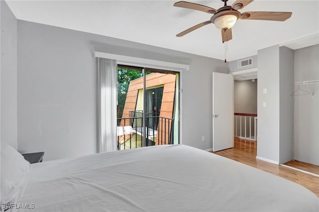 bedroom featuring light hardwood / wood-style floors, ceiling fan, a closet, and access to outside