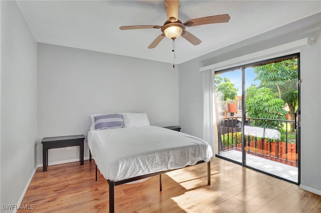 bedroom with light wood-type flooring, ceiling fan, and access to outside