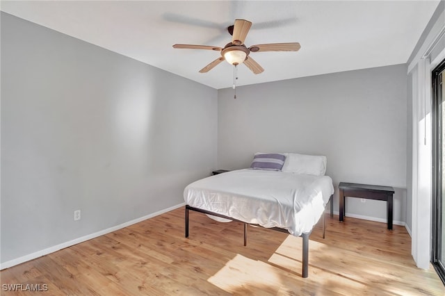 bedroom with ceiling fan and light hardwood / wood-style floors