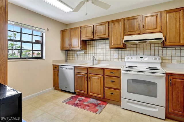 kitchen with tasteful backsplash, white electric stove, sink, ceiling fan, and stainless steel dishwasher