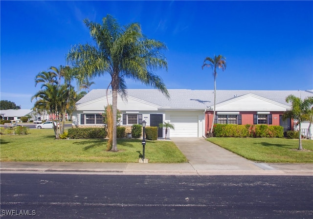 single story home with a garage and a front yard