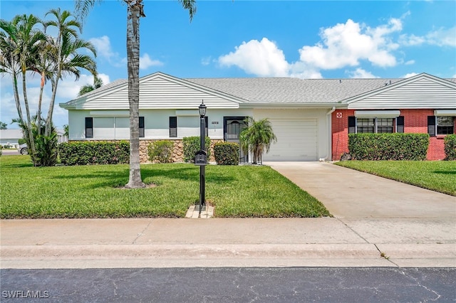 single story home with a front lawn and a garage