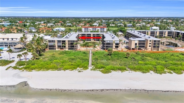 aerial view with a view of the beach and a water view