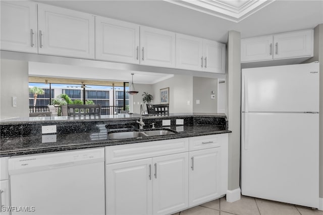 kitchen with white cabinets, white appliances, crown molding, dark stone counters, and sink