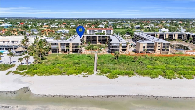 aerial view featuring a water view and a beach view