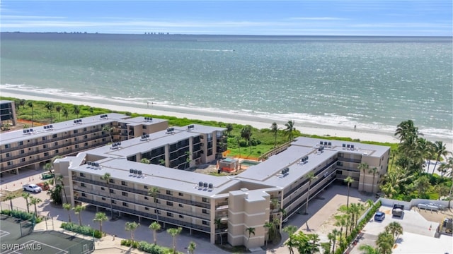 bird's eye view featuring a beach view and a water view