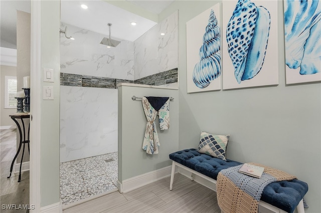 bathroom featuring tiled shower