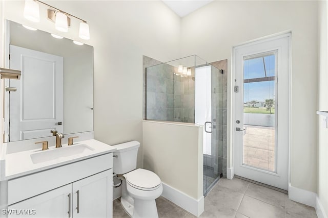 bathroom with vanity, toilet, a shower with shower door, and tile patterned flooring