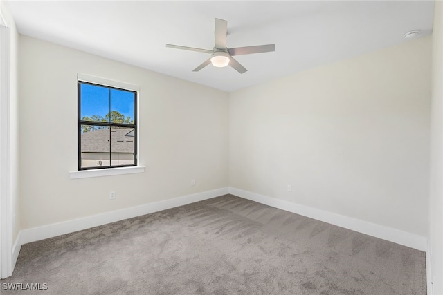 empty room featuring ceiling fan and carpet floors