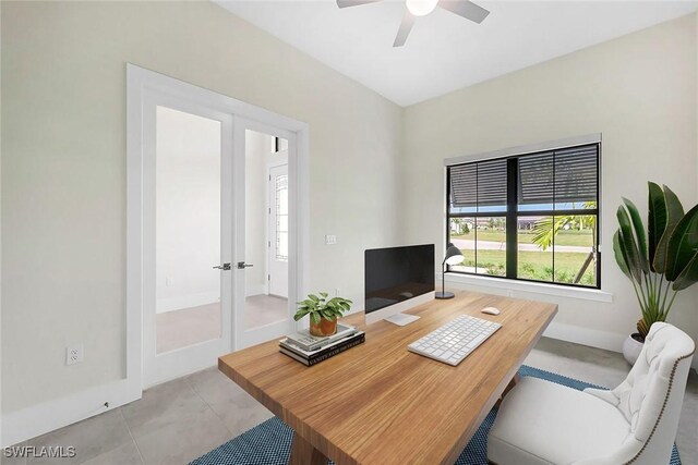 tiled office space featuring ceiling fan and french doors