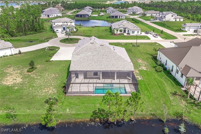 birds eye view of property with a water view