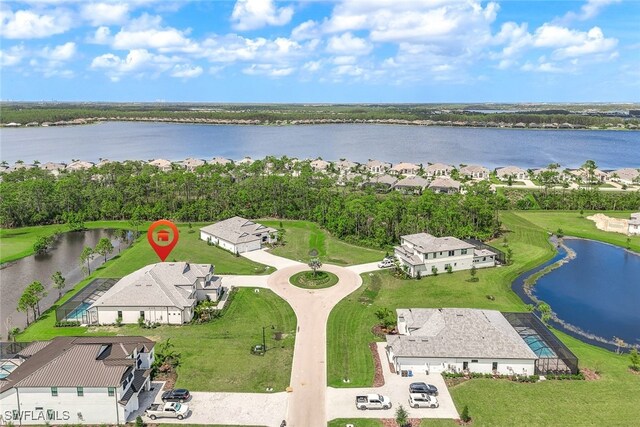 birds eye view of property featuring a water view