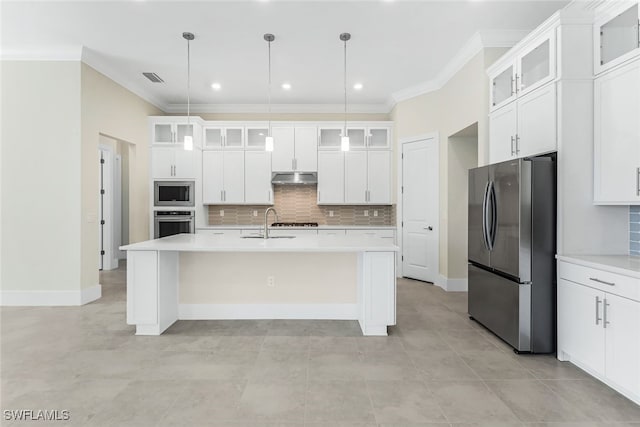 kitchen featuring a kitchen island with sink, appliances with stainless steel finishes, white cabinetry, and backsplash