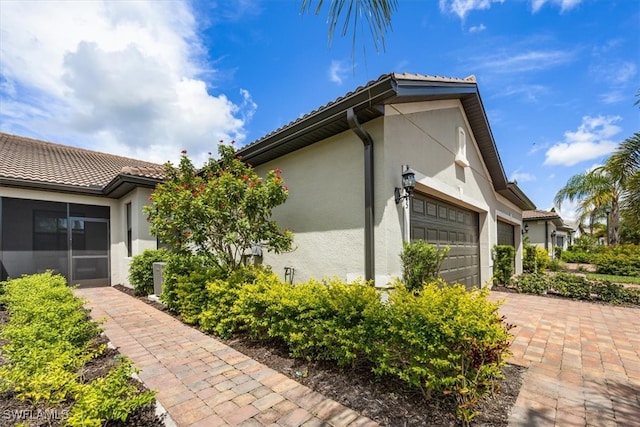 view of property exterior featuring a garage