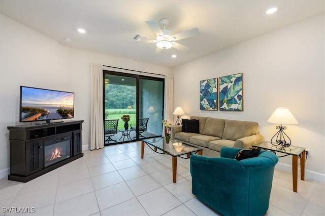 living room with light tile patterned flooring and ceiling fan