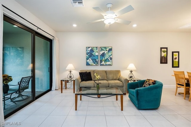 tiled living room with ceiling fan