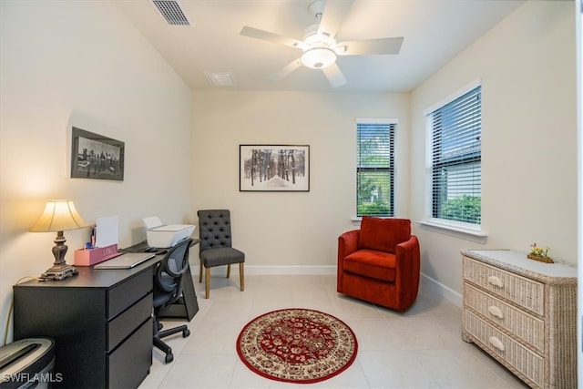 tiled office featuring ceiling fan