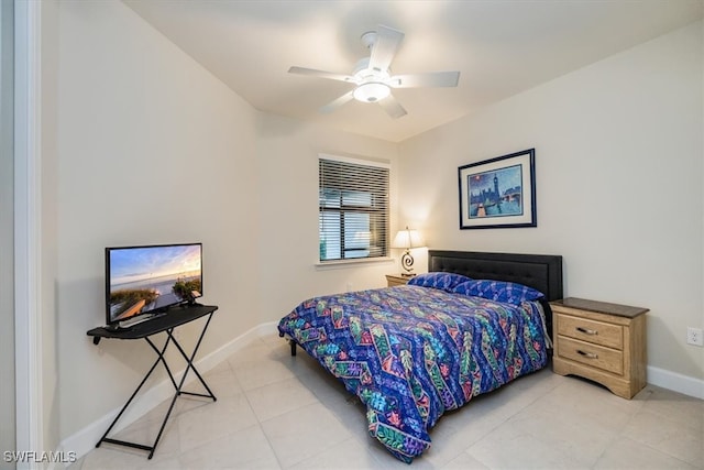 bedroom with ceiling fan and light tile patterned flooring