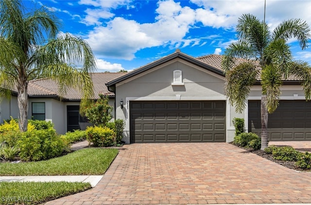 ranch-style home featuring a garage