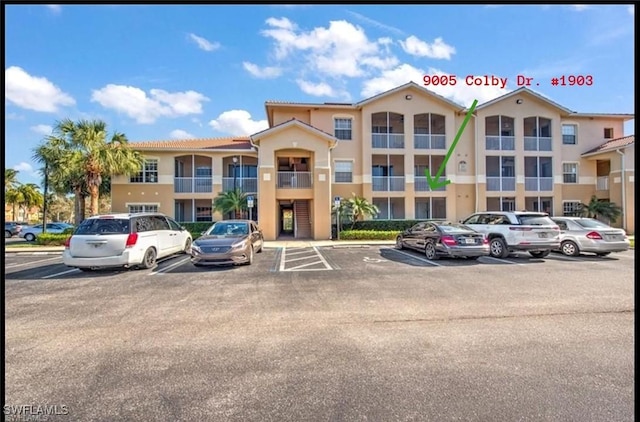 9005 Colby Dr Unit 1903, Fort Myers, FL 33919 - view of property featuring uncovered parking