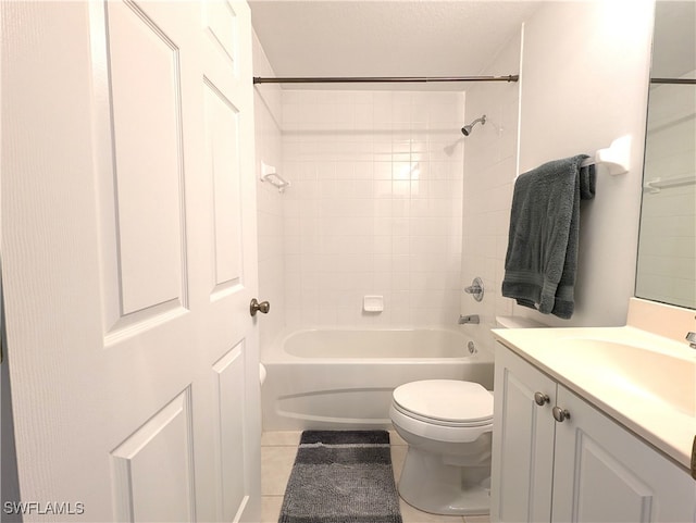 full bathroom with tile patterned flooring, vanity, toilet, and tiled shower / bath