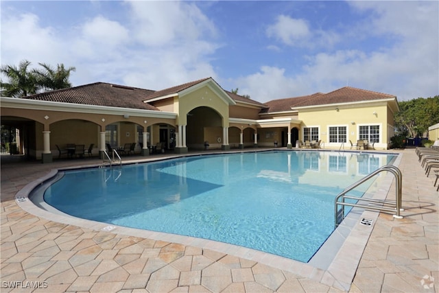 9005 Colby Dr Unit 1903, Fort Myers, FL 33919 - community pool featuring a patio area