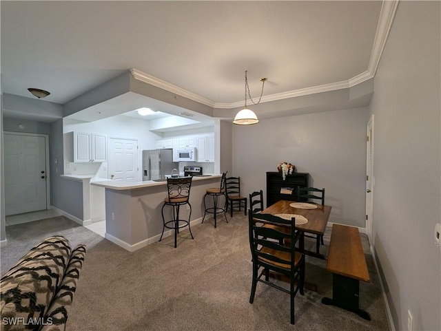 9005 Colby Dr Unit 1903, Fort Myers, FL 33919 - dining space featuring ornamental molding, baseboards, and light colored carpet
