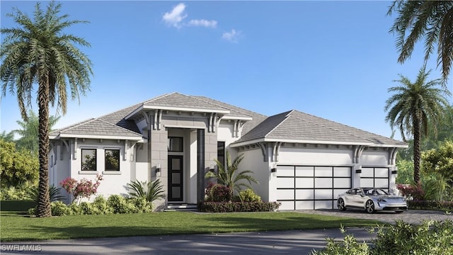 view of front of home featuring a front yard and a garage