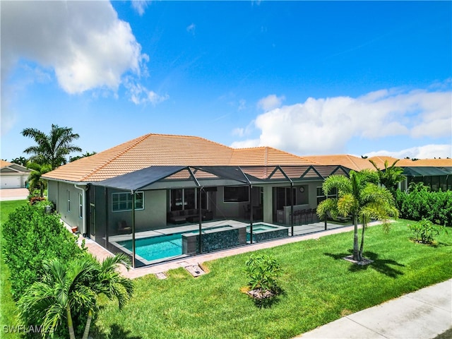 view of pool featuring an in ground hot tub, a yard, a patio, and glass enclosure