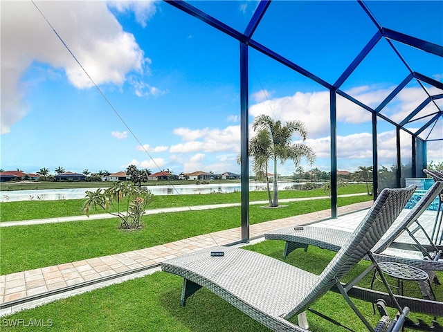 view of home's community with a yard and a water view