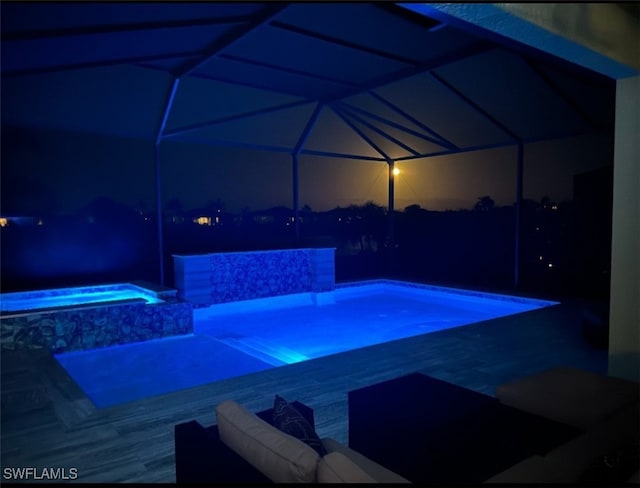 view of pool featuring an in ground hot tub