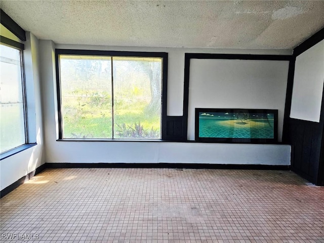 12474 Poem Ave, Punta Gorda, FL 33955 - empty room with a textured ceiling and baseboards