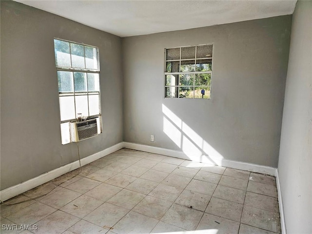12474 Poem Ave, Punta Gorda, FL 33955 - spare room featuring healthy amount of natural light, cooling unit, and light tile patterned floors