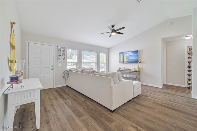 living room with lofted ceiling, dark wood-type flooring, and ceiling fan