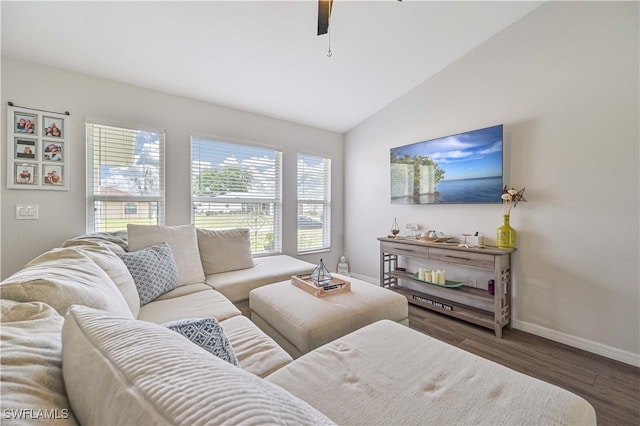 living room featuring ceiling fan, dark hardwood / wood-style floors, and vaulted ceiling