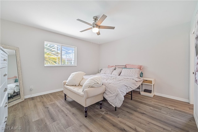 bedroom with light wood-type flooring and ceiling fan