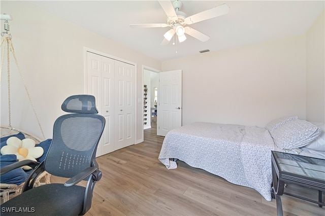 bedroom featuring a closet, ceiling fan, and hardwood / wood-style floors