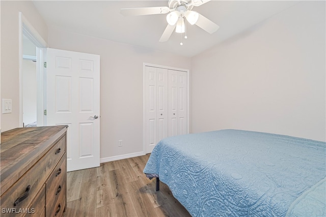 bedroom featuring ceiling fan, a closet, and hardwood / wood-style flooring