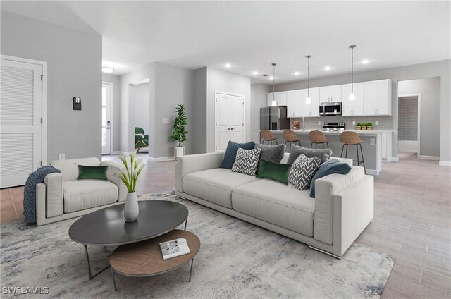 13 SW 34th Pl, Cape Coral, FL 33991 - living area with baseboards, recessed lighting, and light wood finished floors