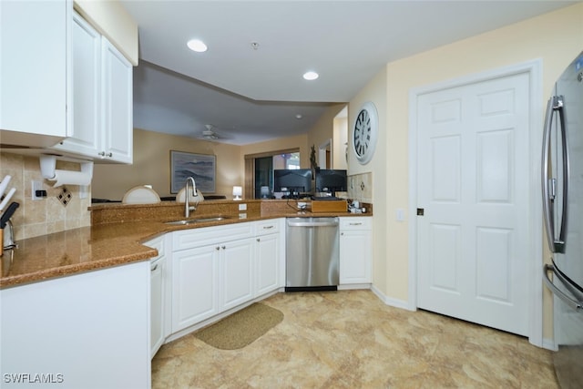 kitchen featuring white cabinetry, kitchen peninsula, stainless steel appliances, and sink