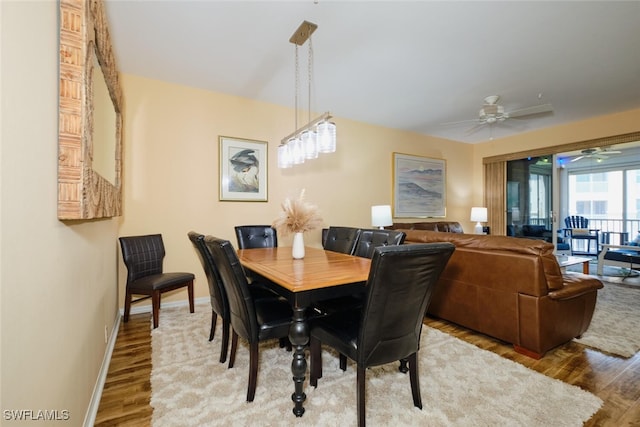 dining area featuring ceiling fan and hardwood / wood-style floors