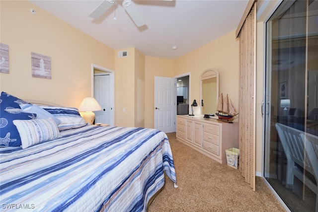 carpeted bedroom featuring ceiling fan and a closet