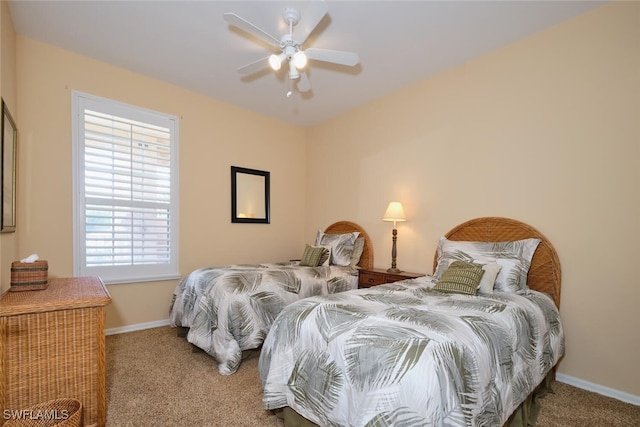 bedroom with ceiling fan and carpet floors